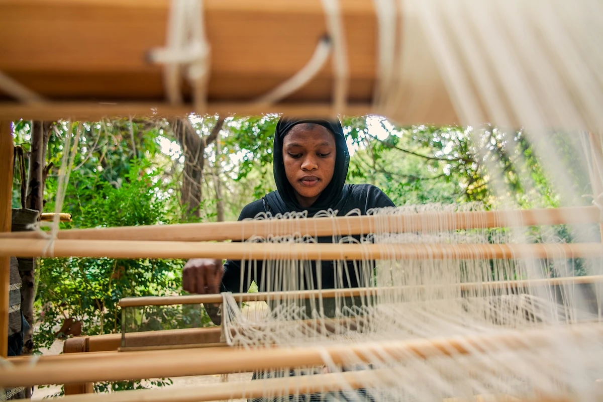 Weavers working on traditional looms on the Gambian coast