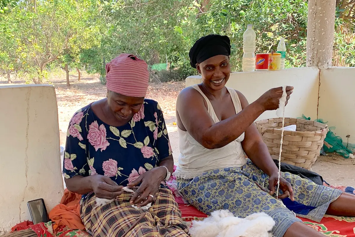 Local women spinning cotton by hand in Njau