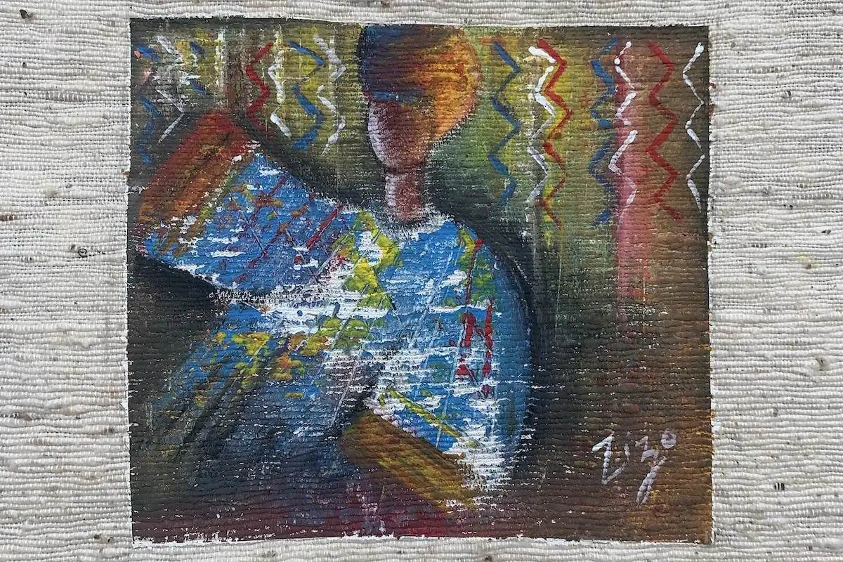 Artists painting on Gambian cotton